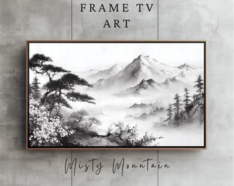 May include: A framed TV art piece depicting a black and white misty mountain scene. The artwork shows trees, flowers, and mountains. The text "FRAME TV ART" is at the top, and "Misty Mountain" is written at the bottom.