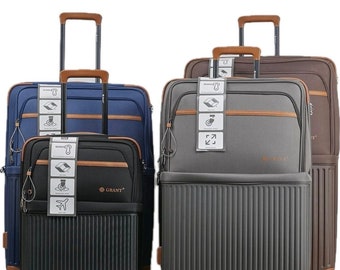 Grant Hybrid 4 pcs Luggage set in a variety of sizes 20, 26, 28, and 32 inches – and 4 colors including black, brown, gray, and navy.