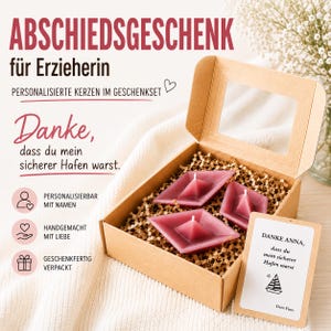 May include: A gift set in a brown cardboard box containing three dark pink boat-shaped candles nestled in shredded paper. A rectangular card is included with the text: DANKE ANNA, dass du mein sicherer Hafen warst, a sailboat icon, and Dein Finn.