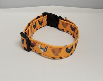 May include: A yellow dog collar with a black buckle and a pattern of colorful chickens.