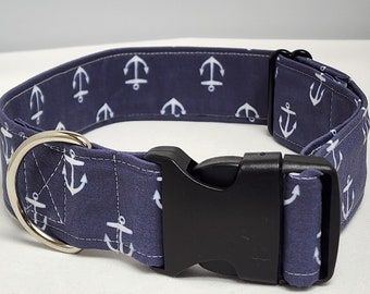 May include: A blue dog collar with white anchor print and a black plastic buckle.