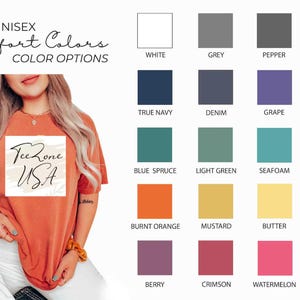May include: An orange unisex t-shirt with the text "Tee Zone USA" in a square design. The image also displays a color chart with various options, including white, grey, and black, and other colors like blue, green, and pink.