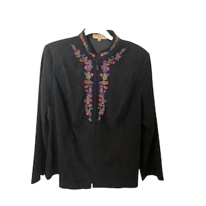 May include: Black jacket with a floral embroidered design in shades of pink, purple, green, and yellow. The jacket has a zipper closure and long sleeves. The brand name "notation" is visible on the label.