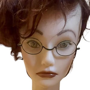 May include: A white ceramic mug with a black handle and the text "But First, Coffee" in a black, bold font. The mug is on a white surface. The mug is 4 inches tall.