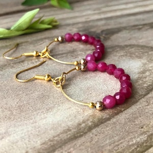 May include: A set of three ceramic mugs with a speckled, matte finish. The mugs are in shades of cream, light gray, and dark gray. Each mug has a simple, minimalist design, perfect for coffee or tea.