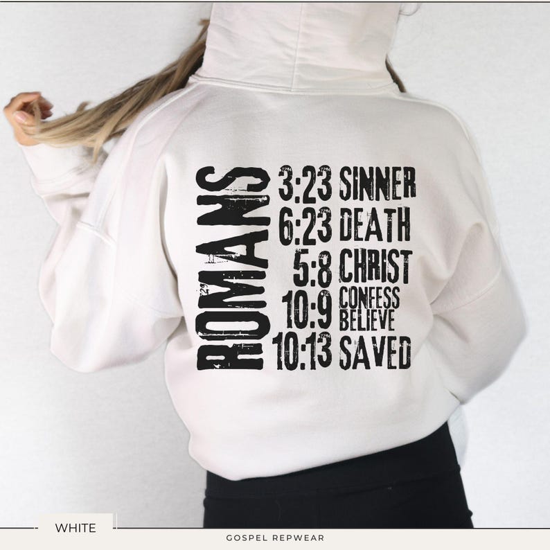 May include: White hoodie with black text that reads "ROMANS" and bible verses, including "3:23 SINNER", "6:23 DEATH", "5:8 CHRIST", "10:9 CONFESS BELIEVE", and "10:13 SAVED".