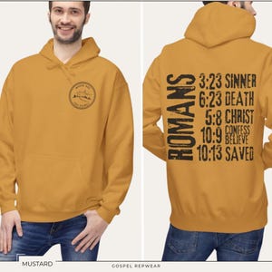 May include: Mustard yellow hoodie with a small graphic on the front and the text "ROMANS 3:23 SINNER 6:23 DEATH 5:8 CHRIST 10:9 CONFESS BELIEVE 10:13 SAVED" on the back.