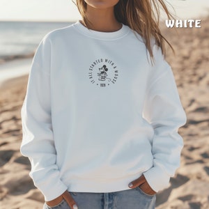 May include: White sweatshirt with a black and white graphic of Mickey Mouse and the text "It all started with a mouse. 1928."