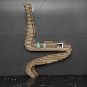 May include: A wooden wall shelf with a unique, curved design. The shelf has two levels and features two small, light blue vases and a framed photo.