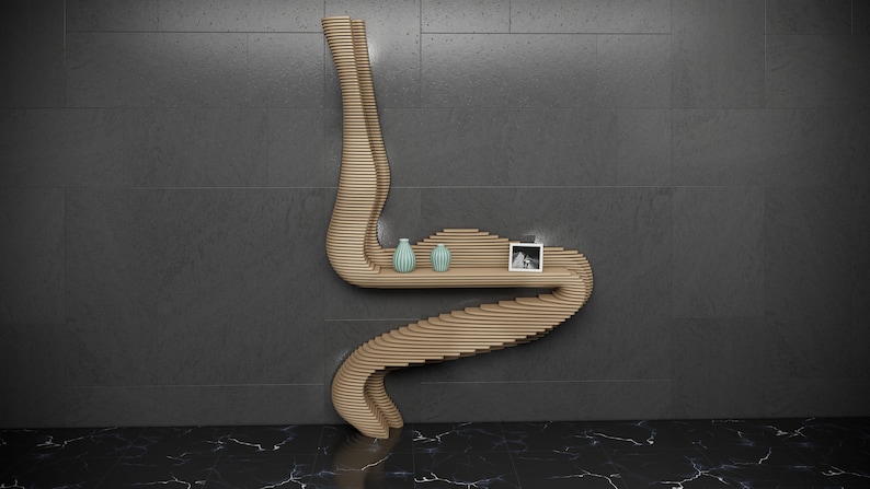 May include: A wooden wall shelf with a unique, curved design. The shelf has two levels and features two small, light blue vases and a framed photo.