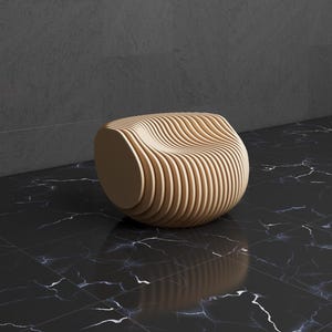 May include: A modern, light-colored wooden chair with a unique, curved design. The chair is made of layered wooden slats, creating a wave-like pattern. The chair sits on a black marble floor.