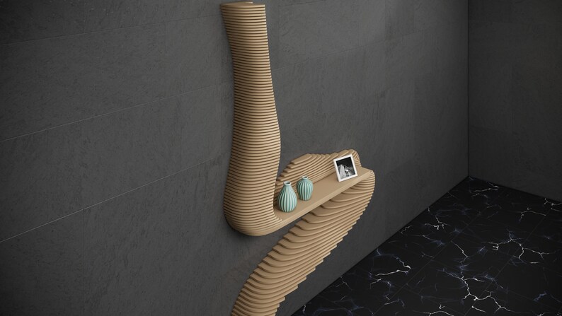 May include: A wooden wall shelf with a unique, wavy design. The shelf has two small, light blue vases and a framed photo on it.
