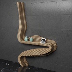 May include: A wooden wall shelf with a unique, curved design. The shelf has two small, light blue vases and a framed photo on it.