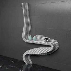 May include: A white, wavy, wall-mounted shelf with two small teal vases and a framed photo on the top shelf.
