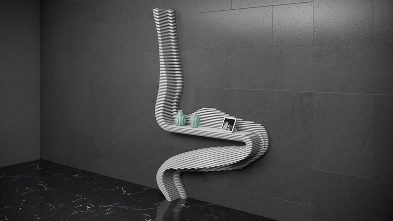 May include: A white, wavy, wall-mounted shelf with two small teal vases and a framed photo on the top shelf.
