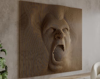 May include: A wooden wall sculpture of a face with a large open mouth, created with layered wood strips. The sculpture is mounted on a light gray wall.