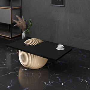 May include: A black coffee table with a unique, layered, wooden base. The table is on a black and white marble floor.
