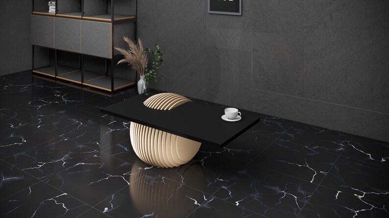 May include: A black coffee table with a unique, layered, wooden base. The table is on a black and white marble floor.