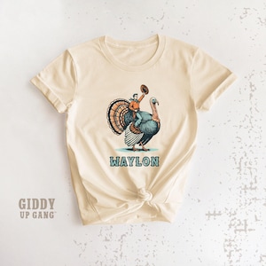 Thanksgiving Rodeo T-Shirt: Cowboy Riding Turkey with Custom Name Shirt ( GF6814 ) image 1