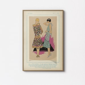 以下が含まれることがあります： 1925 年のヴィンテージファッションイラストで、フラッパーのドレスを着た女性が 2 人描かれています。左側の女性は、ピンクとゴールドのトリムが施された、ゴールドとブラックの幾何学模様のドレスを着ています。右側の女性は、シルバービーズのトリムが施された、ティールブルーのドレスを着ています。イラストはピンクとブラックの背景に描かれています。画像のテキストは「№ 11. 1925」と「16. Nurr se Nolz - Ce riche manteau en faillerine imprimée est doublé d'un satin métalor et garni d'un tissu et original, cette robe de grand métal jade est agréée, craie de ruban très argent. - Tissu de Fourrure de 130, rue de Rivoli, Paris. MATHIET.」です。
