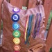 Handmade leather chakra shoulder bag with adjustable cross body strap. Leather messenger style bag. The Emily Chakra bag.