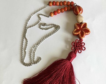 Burgundy pompom long necklace, maedup, red flower ceramic bead, beige heart on silver stainless chain