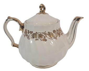 Tetera vintage Salder England Swirl color marfil con detalles y motivos florales.