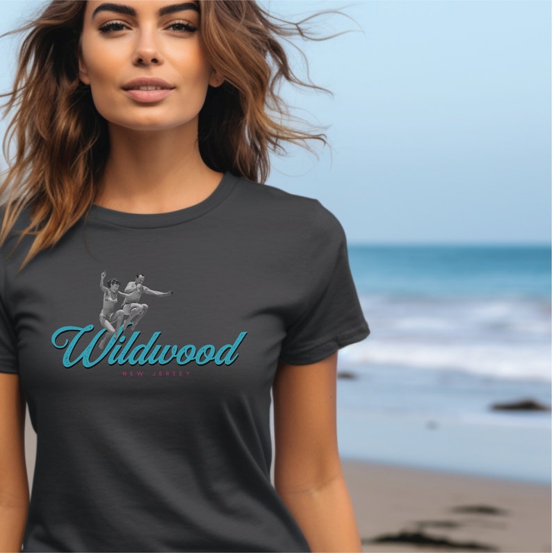 May include: A dark gray t-shirt with a vintage-style graphic of two people jumping off a pier with the text "Wildwood, New Jersey" underneath.