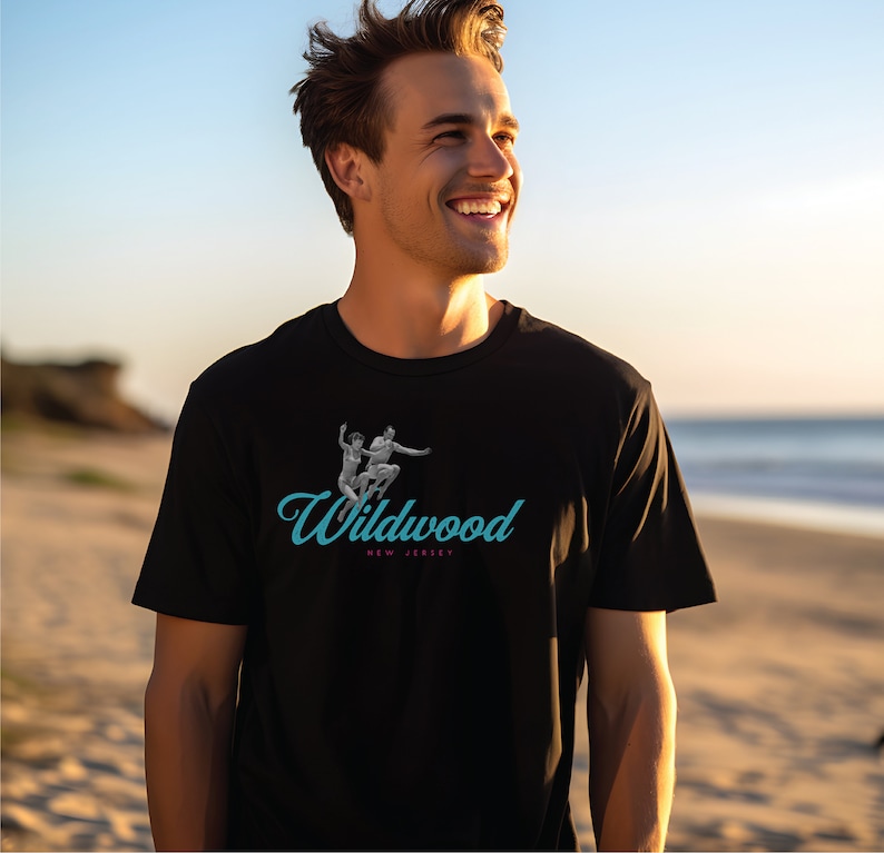 May include: A black t-shirt with a blue and white graphic of two people jumping in the air. The graphic is accompanied by the text "Wildwood, New Jersey".