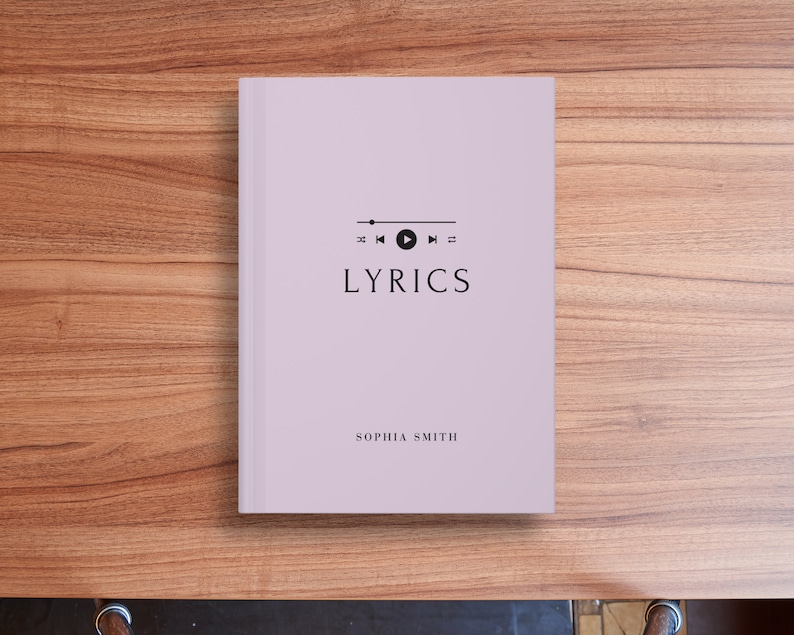 May include: A lavender-colored book with the title "LYRICS" in black text. The book has a black music player icon with play, rewind, and fast forward buttons. The author's name, "SOPHIA SMITH", is printed in black at the bottom of the cover.