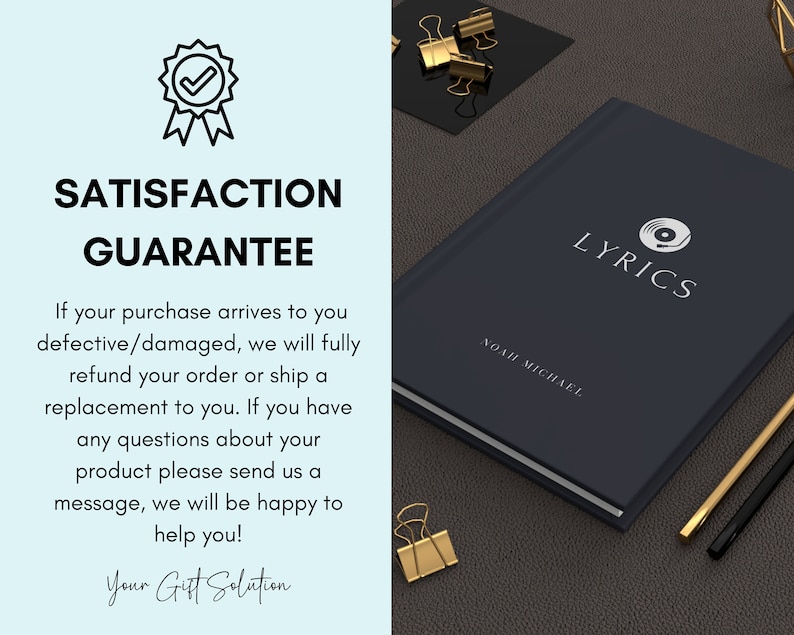 May include: A dark blue notebook with the word "LYRICS" in white text and a white record player icon. The notebook has the name "NOAH MICHAEL" printed in white text. The notebook is on a brown surface with gold paper clips and a black and gold pen.