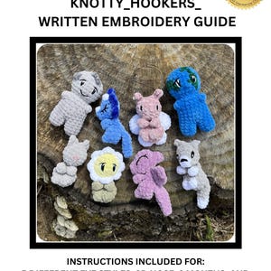 May include: A collection of seven small, plush, crocheted figures in various colors including gray, blue, pink, and white. The text reads KNOTTY_HOOKERS_ WRITTEN EMBROIDERY GUIDE and INSTRUCTIONS INCLUDED FOR: 5 DIFFERENT EYE STYLES, 3D NOSE, 2 MOUTHS, AND MORE.