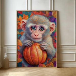 May include: A cute monkey with big blue eyes holds a bright orange pumpkin in its hands. The monkey is surrounded by colorful autumn leaves.