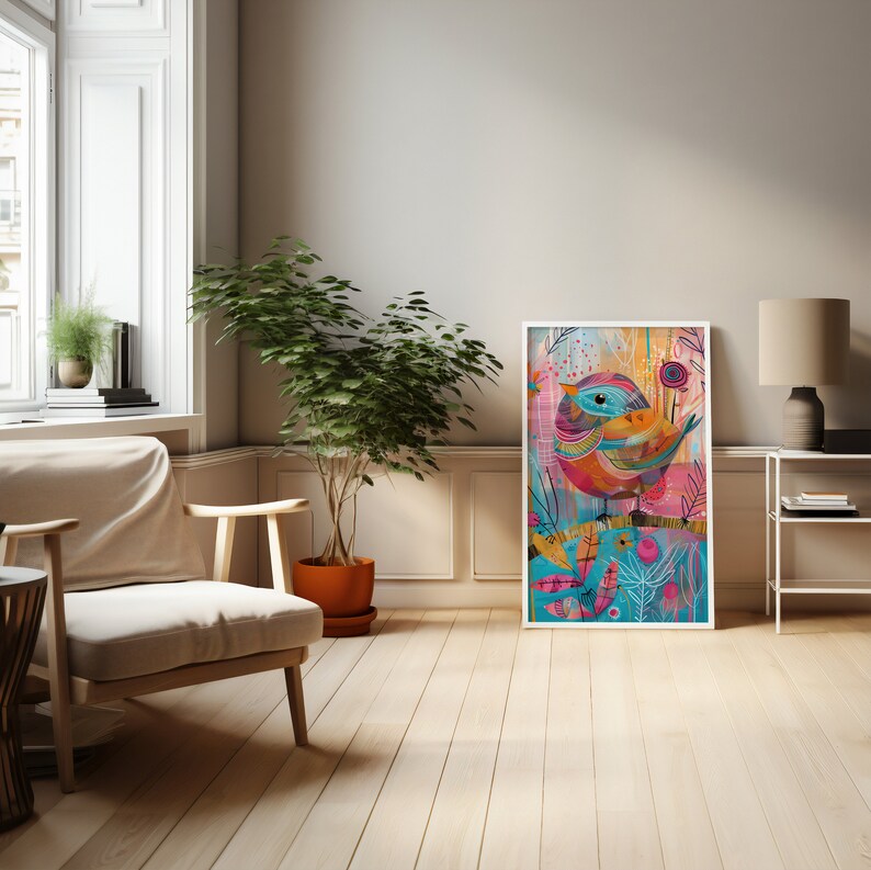 May include: A colorful abstract painting of a bird with a blue head and yellow beak, surrounded by pink, blue, and green foliage. The painting is framed in a white frame and hanging on a wall in a living room.