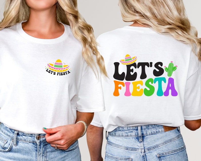 May include: Two white t-shirts with a festive Mexican theme. One shirt features a colorful sombrero and the text "Let's Fiesta". The other shirt features the text "Let's Fiesta" in colorful letters with a cactus.