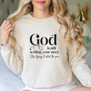 God Is Still Writing Your Story Sweatshirt - Christian Inspirational Gift