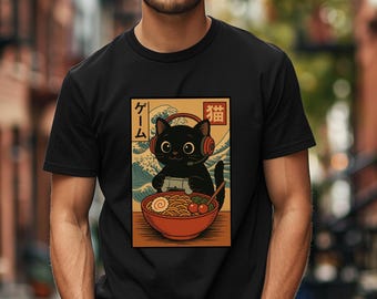 May include: Black t-shirt featuring a graphic of a black cat wearing headphones and playing a video game. The cat is sitting in front of a bowl of ramen. Japanese text is visible in the image.