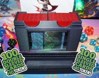 May include: Black and red card storage box with a clear window, holding a card. The box is surrounded by dice of various colors and shapes. Two stickers read "100 Double Sleeved Cards +10 Tokens" and "100 Single Sleeved Cards +40 Tokens".
