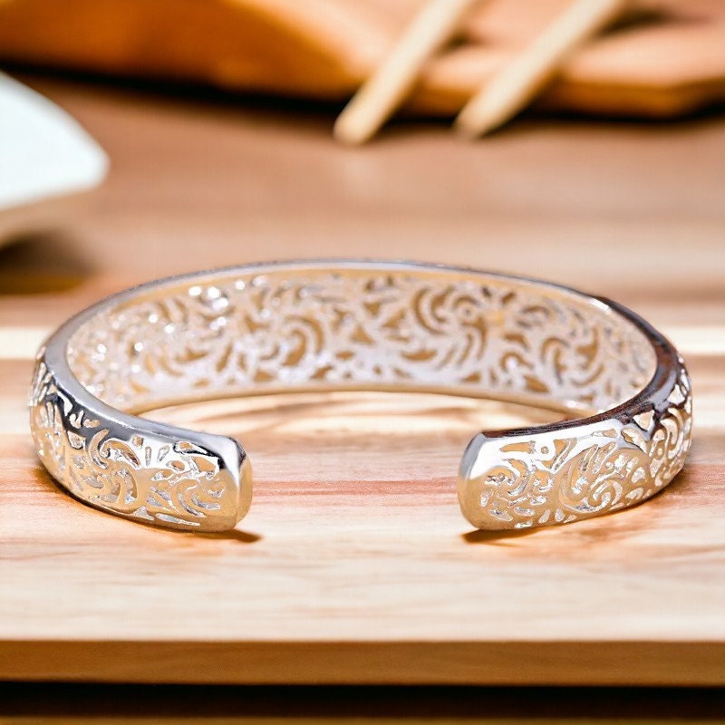 Hollow silver bangle best sale