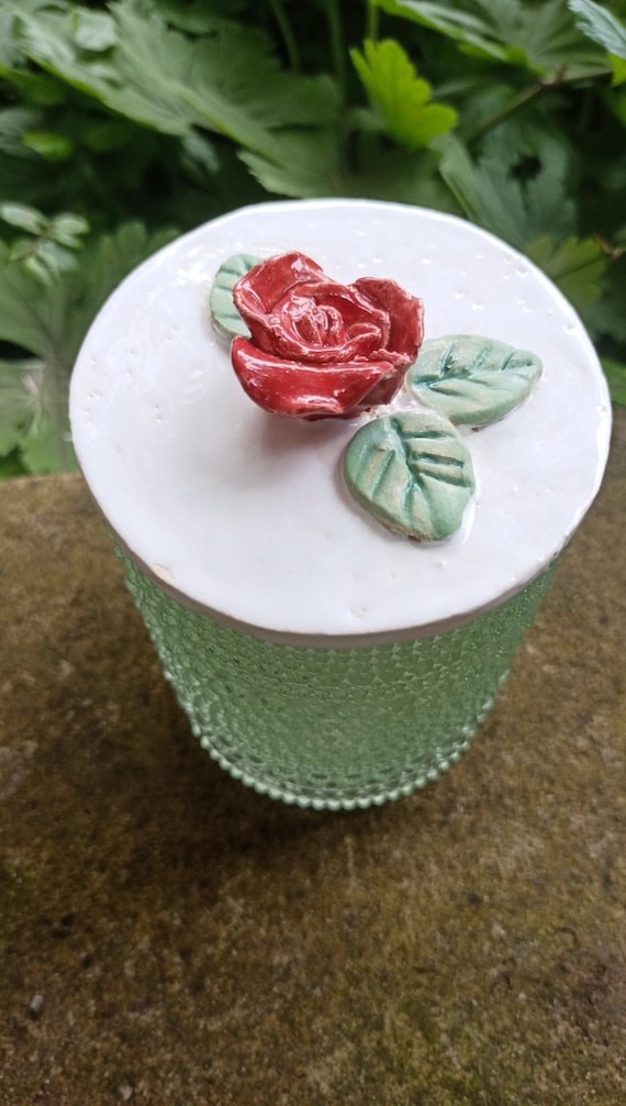 Storage jar for utensils with a handmade lid made of glazed ceramic decorated with a red rose Utensil jar storage container