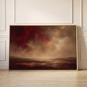 Peut inclure: Une peinture de paysage rectangulaire dans un cadre en bois clair représentant un ciel dramatique avec des nuages rouge cramoisi profond et brun foncé au-dessus d'une ligne d'horizon plate et texturée aux tons mélangés.