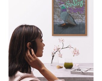 May include: A framed artwork featuring a stylized pigeon with graffiti text. The pigeon is depicted in shades of gray, blue, and green, set against a brick wall background. The text includes the word "Fucking" in green.