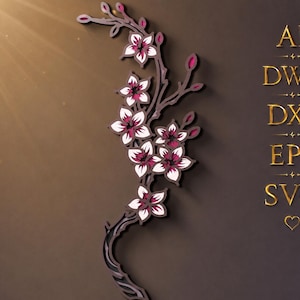 May include: A layered, multi-dimensional wall art piece depicting a flowering branch with white and dark pink blossoms. The design features intricate cutouts and includes the text AI, DWG, DXF, EPS, and SVG in gold lettering on the right side.