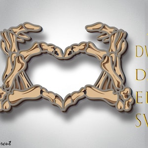 May include: A skeletal hand design in the shape of a heart. The design is in shades of brown and beige.