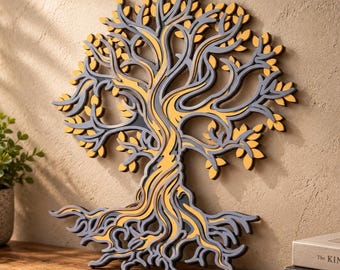 May include: A layered wall art piece shaped like a tree with intricate, swirling branches and roots. The design features a contrasting colour scheme of dark grey and mustard yellow, creating a dimensional effect with cut-out leaf patterns.
