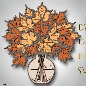 Könnte beinhalten: Ein geschichtetes Holzkunstwerk, das einen Strauß Ahornblätter im Herbst in Orange-, Braun- und Beigetönen zeigt, angeordnet in einer Vase. Das Bild enthält den Text "AI, DWG, DXF, EPS, SVG" und "Bylaser cut".