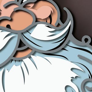 May include: A layered paper art cutout depicting a stylized face with a large white mustache and beard, light blue facial hair accents, and peach-toned skin. The design features bold gray outlines and depth created by stacked paper layers.