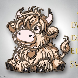 May include: A layered, cartoon-style illustration of a Highland cow calf in shades of brown and tan. The calf is sitting with a heart-shaped marking on its chest. The image includes the text "AI, DWG, DXF, EPS, SVG" and "Bylaser cut".
