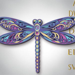 May include: A layered paper dragonfly design in shades of purple, blue, yellow, and pink. The dragonfly has intricate wing details and a segmented body. The image also includes the text "AI, DWG, DXF, EPS, SVG" in gold.