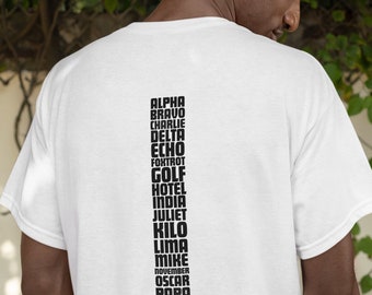 May include: White t-shirt with black text listing the NATO phonetic alphabet. The text reads: Alpha, Bravo, Charlie, Delta, Echo, Foxtrot, Golf, Hotel, India, Juliet, Kilo, Lima, Mike, November, Oscar, Papa, Quebec, Romeo, Sierra, Tango, Uniform, Victor, Whiskey, X-ray, Yankee, Zulu.